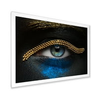 Designart 'Girl szeme arany lánccal és kék pigmenttel' Modern keretes művészeti nyomtatás